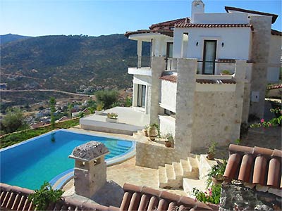 stunning two storey villa on hillside with private pool under clear blue skies