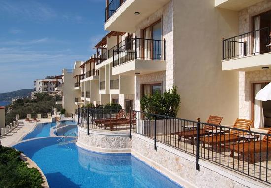 Luxury apartment blocks on steep mountain inclines, with pools in front